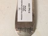a silver spoon that has a price tag on it