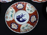 many plates with designs on them on a table