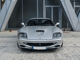 a silver sports car parked in front of a building
