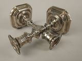pair of silver plated candlesticks on a white background