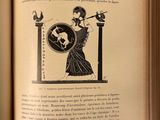 an open book with a drawing of a woman holding a sword and shield