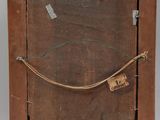 an old wooden easel with a piece of paper on top of it