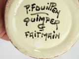 a person holding a cup with writing on it
