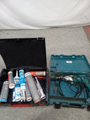 two tools in a case on the floor next to each other