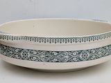 a white bowl with a black and white design on it