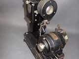 an old camera sitting on top of a table