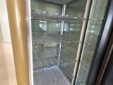an image of an empty refrigerator in a kitchen
