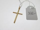 a close up of a cross and a price tag on a table