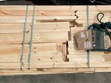a wooden crate with a pair of scissors on top of it