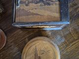 a small box with a picture on it sitting on a table