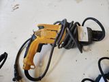 a cord that is connected to a drill on a table