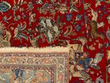 an image of a red carpet with a pattern of birds and flowers on it