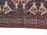 an old rug with a design of flowers and leaves on a white background