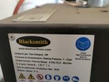 the back of a machine that is sitting on top of a table