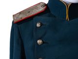 the back of a blue military jacket with gold buttons on a mannequin head