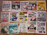 a lot of posters on the floor of a room