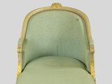 an image of a green chair with gold trim