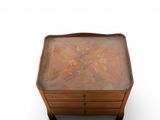 a small wooden table with a drawer underneath it