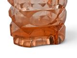 a glass vase that has a bear design on it