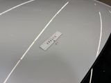 a sticker on the hood of a white car