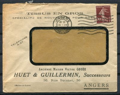 an old envelope with a stamp on it sitting on a table