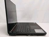 an open laptop computer sitting on top of a white surface