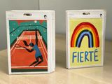 two cards with different designs on them on a table