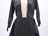 black dress with white lace collar and cuffs on a mannequin