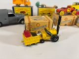 a lot of toy cars and trucks that are on the table