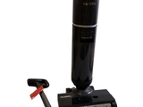 a vacuum that is sitting next to a toothbrush