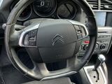 a steering wheel and dashboard of a small car