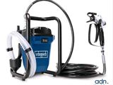 an image of a blue and black vacuum with a hose and a spray gun