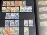 a lot of stamps on a book on a table