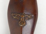 a brown vase with a gold eagle on it