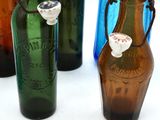three bottles that are sitting next to each other on a table