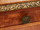 a small wooden box with a decorative design on it
