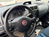 the dashboard of a car with a steering wheel and dashboard controls