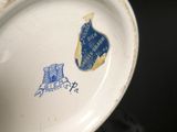 a close up of a plate with a blue and white design on it