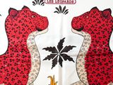 two red leopards that are standing next to each other