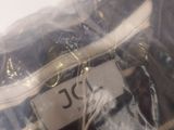 a plastic bag with a label on it sitting on a table