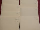 three sheets of paper are stacked on top of each other on a table