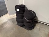 a pair of boots sitting on the floor next to a wall