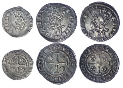 six ancient roman coins, one of which has a cross on it