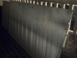 an image of the inside of a building with a metal fence