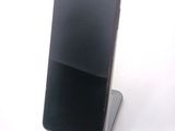 a cell phone that is sitting on top of a stand