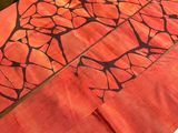 a table that has a table cloth with a design on it