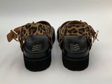 a pair of leopard print shoes on a white background