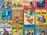 many children ' s books are lined up on a table