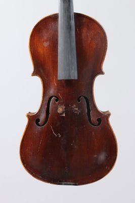 an old violin with a bow hanging from it ' s back