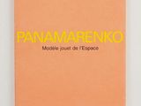a pink notebook with yellow lettering that reads panamano on it